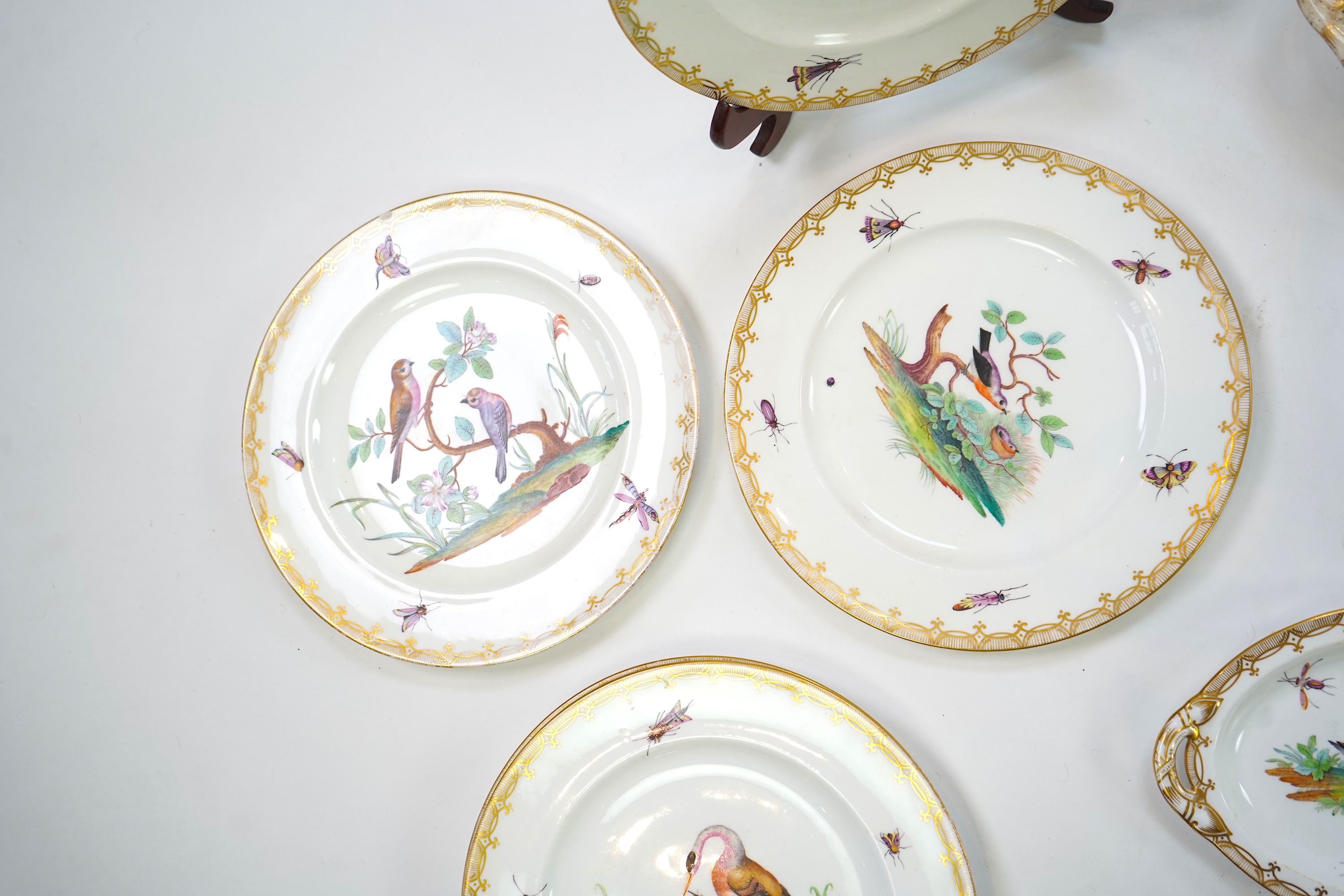 A Coalport bird painted part dinner service, mid 19th century